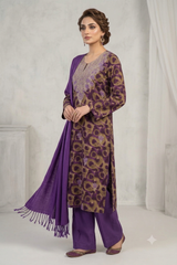 A woman models a traditional Indian salwar kameez suit set in purple and gold. The set includes a purple kurta with gold circular patterns, matching purple trousers, and a purple dupatta with fringe.