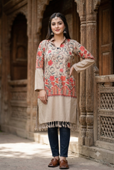 Beige Kashmiri embroidered woolen kurti worn by a woman